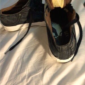 A gently used pair of Diesel tennis shoes, very cool, in black denim. Size US 8
